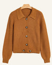 A ribbed knit cardigan sweater in a warm camel brown color, featuring a pointed collar and dark brown buttons.