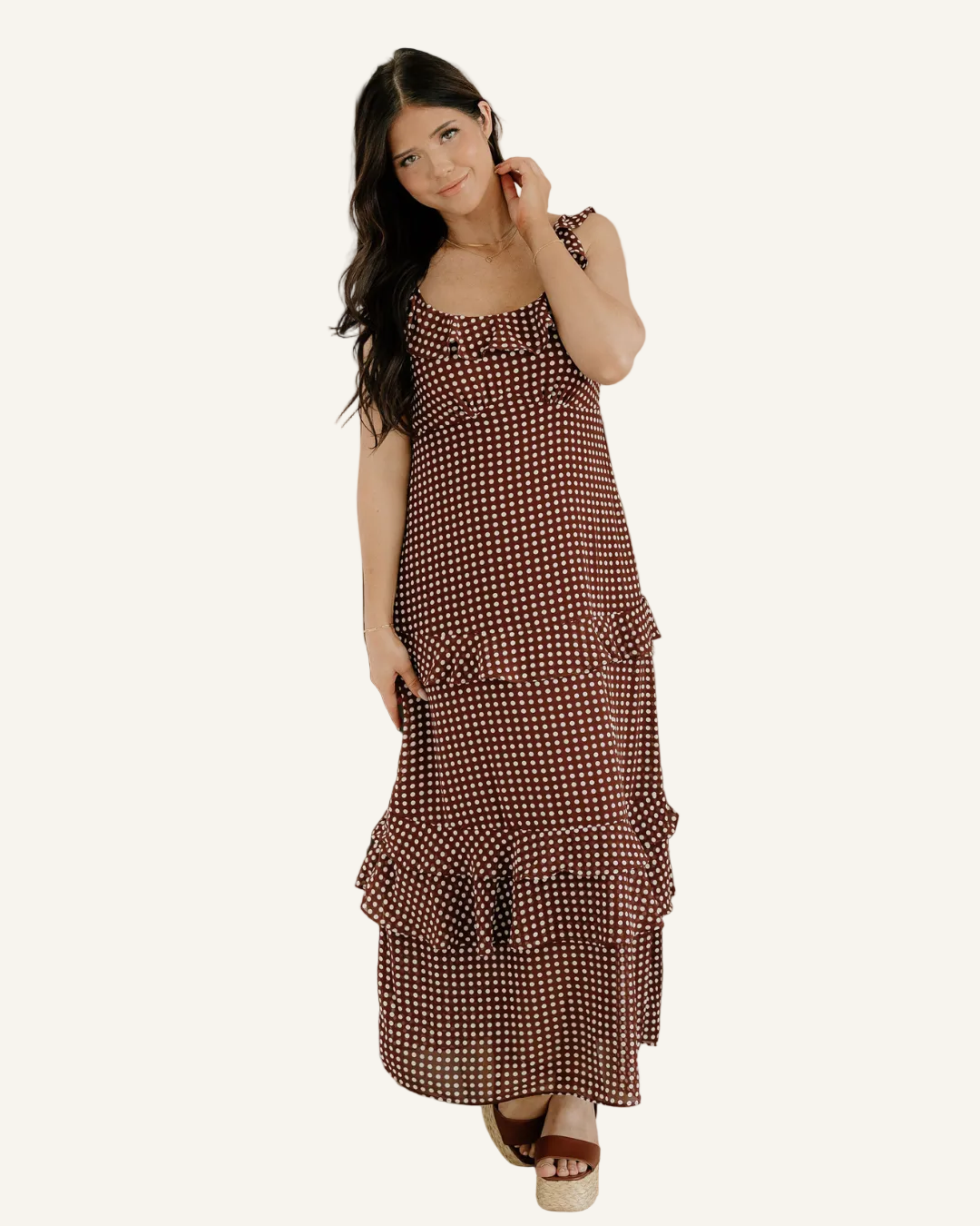 Woman wearing a polka dot dress.