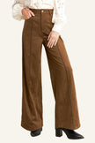 Brown wide-leg pants worn by a person on a white background