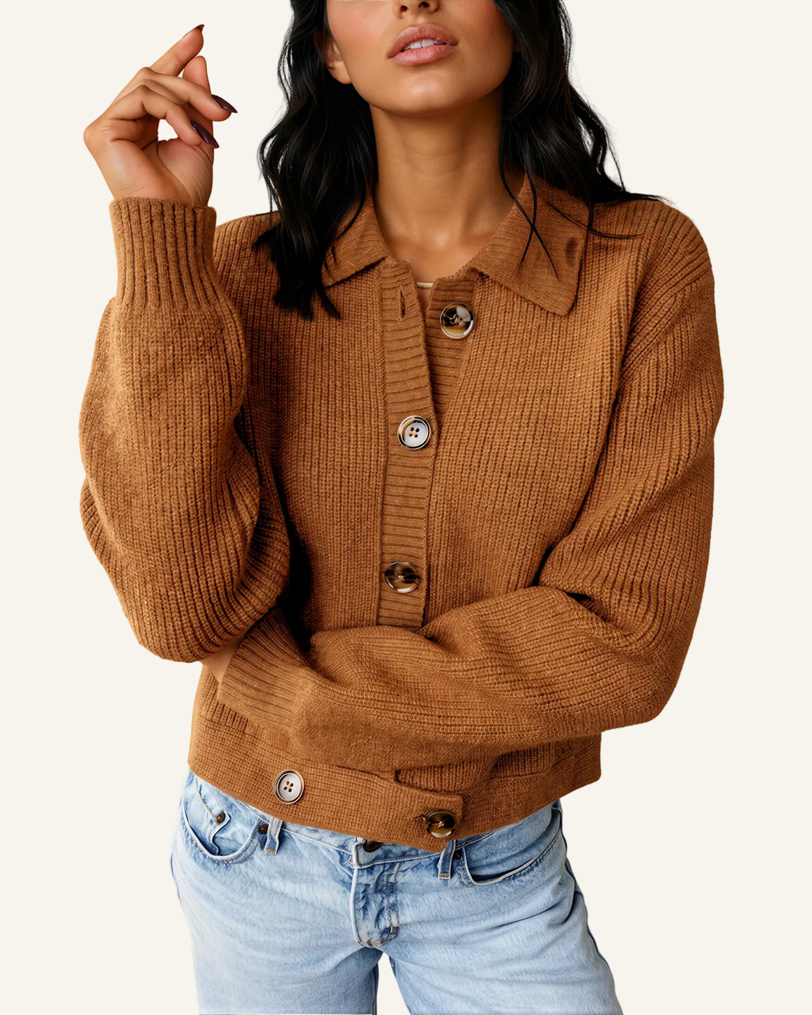 A woman wearing a brown ribbed knit button-front cardigan with a collar and light-wash blue jeans.